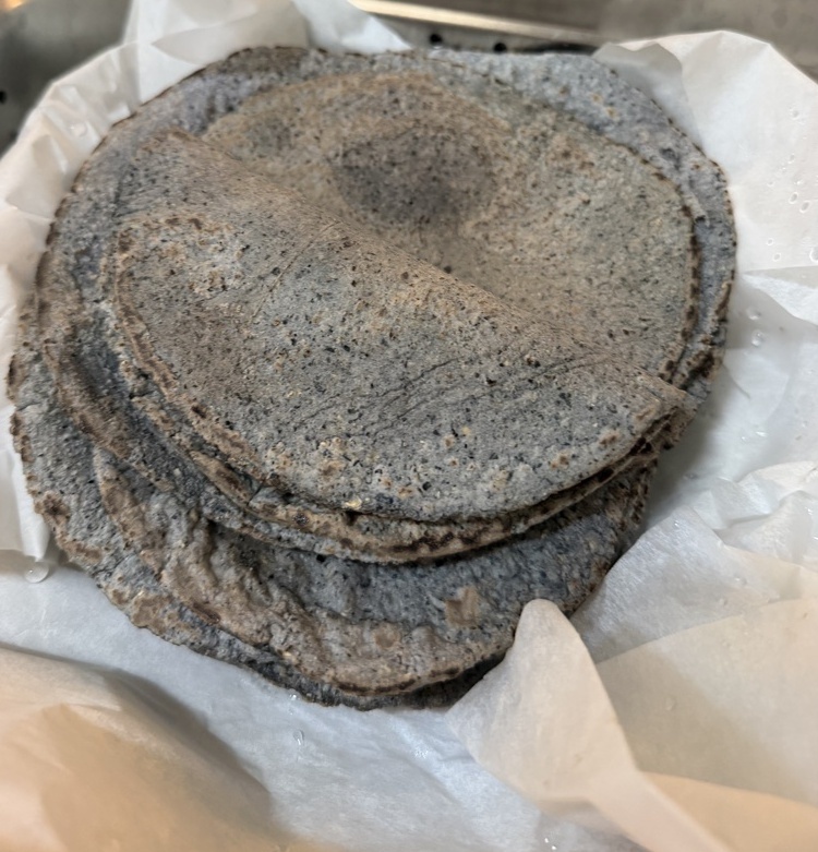 A stack of blue corn tortillas