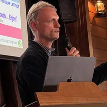 A speaker giving a talk at a VWR retreat