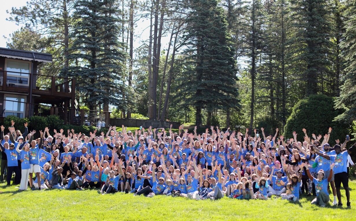 VWR 2026 group photo β guests in blue shirts at the lodge